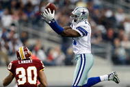 ARLINGTON, TX - NOVEMBER 22:  Wide receiver Roy Williams #11 of the Dallas Cowboys drops a pass in front of LaRon Landry #30 of the Washington Redskins at Cowboys Stadium on November 22, 2009 in Arlington, Texas.  (Photo by Ronald Martinez/Getty Images)