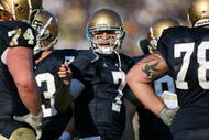 SOUTH BEND, IN - NOVEMBER 21: Jimmy Clausen #7 of the Notre Dame Fighting Irish calls a play in the huddle against the Univeristy of Connecticut Huskies at Notre Dame Stadium on November 21, 2009 in South Bend, Indiana. Connecticut defeated Notre Dame 33-30 in double overtime. (Photo by Jonathan Daniel/Getty Images)