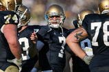 SOUTH BEND, IN - NOVEMBER 21: Jimmy Clausen #7 of the Notre Dame Fighting Irish calls a play in the huddle against the Univeristy of Connecticut Huskies at Notre Dame Stadium on November 21, 2009 in South Bend, Indiana. Connecticut defeated Notre Dame 33-30 in double overtime. (Photo by Jonathan Daniel/Getty Images)
