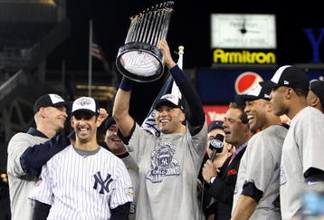 NEW YORK - NOVEMBER 04:  Derek Jeter #2 of the New York Yankees holds up the trophy as he celebrates with A.J. Burnett (L), Jorge Posada (2nd L), Mariano Rivera (2nd R) and Robinson Cano after their 7-3 win against the Philadelphia Phillies in Game Six of the 2009 MLB World Series at Yankee Stadium on November 4, 2009 in the Bronx borough of New York City.  (Photo by Jed Jacobsohn/Getty Images)