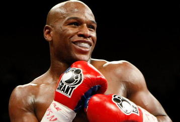 LAS VEGAS - SEPTEMBER 19:  Floyd Mayweather Jr. smiles in the ring during his fight against Juan Manuel Marquez at the MGM Grand Garden Arena September 19, 2009 in Las Vegas, Nevada. Mayweather won by unanimous decision.  (Photo by Ethan Miller/Getty Images)
