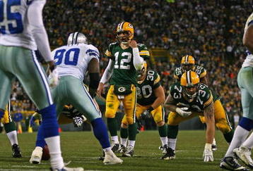 GREEN BAY, WI - NOVEMBER 15: Aaron Rodgers #12 of the Green Bay Packers walks up to the line scrimmage beofre calling a play against the Dallas Cowboys at Lambeau Field on November 15, 2009 in Green Bay, Wisconsin. The Packers defeated the Cowboys 17-7. (Photo by Jonathan Daniel/Getty Images)