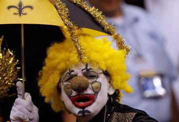 NEW ORLEANS - NOVEMBER 08:  A fan cheers on the New Orleans Saints at Louisiana Superdome on November 8, 2009 in New Orleans, Louisiana.  (Photo by Ronald Martinez/Getty Images)