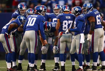 EAST RUTHERFORD, NJ - NOVEMBER 22:  Eli Manning #10 of the the New York Giants gives instructions to his team mates against the Atlanta Falcons on November 22, 2009 at Giants Stadium in East Rutherford, New Jersey.  (Photo by Chris McGrath/Getty Images)