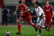 BUDAPEST, HUNGARY - NOVEMBER 24:  Steven Gerrard of Liverpool goes around Zoltan Szelesi during the UEFA Champions League group E match between Debrecen and Liverpool at the Ferenc Puskas Stadium on November 24, 2009 in Budapest, Hungary.  (Photo by Richard Heathcote/Getty Images)