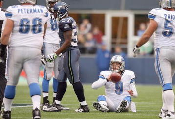 SEATTLE - NOVEMBER 08:  Quarterback Matthew Stafford #9 of the Detroit Lions on the ground after a play during the game against the Seattle Seahawks on November 8, 2009 at Qwest Field in Seattle, Washington. The Seahawks defeated the Lions 32-20. (Photo by Otto Greule Jr/Getty Images)