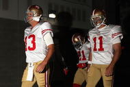 GLENDALE, AZ - SEPTEMBER 13:  Quarterbacks Shaun Hill #13 and Alex Smith #11 of the San Francisco 49ers walk out onto the field prior to the NFL game against the Arizona Cardinals at the Universtity of Phoenix Stadium on September 13, 2009 in Glendale, Arizona.  (Photo by Christian Petersen/Getty Images)
