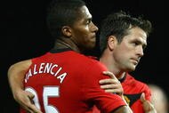 MANCHESTER, ENGLAND - NOVEMBER 21:  Antonio Valencia of Manchester United is congratulated by team mate Michael Owen after scoring his team's third goal during the Barclays Premier League match between Manchester United and Everton at Old Trafford on November 21, 2009 in Manchester, England.  (Photo by Alex Livesey/Getty Images)