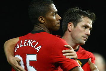 MANCHESTER, ENGLAND - NOVEMBER 21:  Antonio Valencia of Manchester United is congratulated by team mate Michael Owen after scoring his team's third goal during the Barclays Premier League match between Manchester United and Everton at Old Trafford on November 21, 2009 in Manchester, England.  (Photo by Alex Livesey/Getty Images)