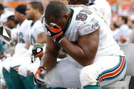 MIAMI - JANUARY 04: Jason Ferguson #95 of the Miami Dolphins sits on the bench during the final minuets of their 27-9 AFC Wild Card loss to the Baltimore Ravens on January 4, 2009 at Dolphin Stadium in Miami, Florida. (Photo by Gregory Shamus/Getty Images)