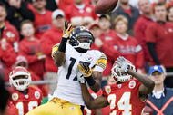 KANSAS CITY, MO - NOVEMBER 22:  Wide receiver Mike Wallace #17 of the Pittsburgh Steelers jumps to make a catch over defensive back Brandon Flowers #24 of the Kansas City Chiefs at Arrowhead Stadium on November 22, 2009 in Kansas City, Missouri.  The Chiefs defeated the Steelers 27-24.  (Photo by Wesley Hitt/Getty Images)