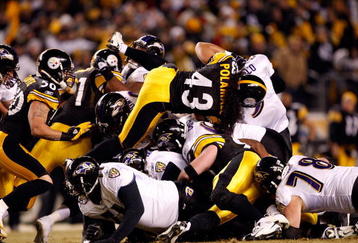 PITTSBURGH - JANUARY 18:  Troy Polamalu #43 of the Pittsburgh Steelers and the Steeler defense stop quarterback Joe Flacco #5 of the Baltimore Ravens on a 4th and 1 play during the AFC Championship game on January 18, 2009 at Heinz Field in Pittsburgh, Pennsylvania.  (Photo by Streeter Lecka/Getty Images)