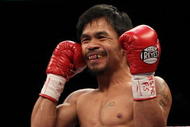 LAS VEGAS - NOVEMBER 14: Manny Pacquiao smiles before taking on Miguel Cotto during their WBO welterweight title fight at the MGM Grand Garden Arena on November 14, 2009 in Las Vegas, Nevada. (Photo by Al Bello/Getty Images)
