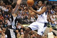 DALLAS - NOVEMBER 18:  Rodrigue Beaubois #3 of the Dallas Mavericks takes the ball to the basket against Manu Ginobili #20 of the San Antonio Spurs during the game at American Airlines Center on November 18, 2009 in Dallas, Texas. NOTE TO USER: User expressly acknowledges and agrees that, by downloading and or using this photograph, User is consenting to the terms and conditions of the Getty Images License Agreement. (Photo by Ronald Martinez/Getty Images)
