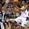 DALLAS - NOVEMBER 18: Rodrigue Beaubois #3 of the Dallas Mavericks takes the ball to the basket against Manu Ginobili #20 of the San Antonio Spurs during the game at American Airlines Center on November 18, 2009 in Dallas, Texas. NOTE TO USER: User expressly acknowledges and agrees that, by downloading and or using this photograph, User is consenting to the terms and conditions of the Getty Images License Agreement. (Photo by Ronald Martinez/Getty Images)