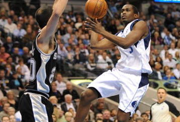 DALLAS - NOVEMBER 18:  Rodrigue Beaubois #3 of the Dallas Mavericks takes the ball to the basket against Manu Ginobili #20 of the San Antonio Spurs during the game at American Airlines Center on November 18, 2009 in Dallas, Texas. NOTE TO USER: User expressly acknowledges and agrees that, by downloading and or using this photograph, User is consenting to the terms and conditions of the Getty Images License Agreement. (Photo by Ronald Martinez/Getty Images)