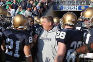 SOUTH BEND, IN - NOVEMBER 21: Head coach Charlie Weis of the Notre Dame Fighting Irish stands with his team before lining up to enter the field for a game against the University of Connecticut Huskies at Notre Dame Stadium on November 21, 2009 in South Bend, Indiana. (Photo by Jonathan Daniel/Getty Images)