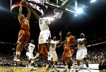 KANSAS CITY, MO - NOVEMBER 24:  Dogus Balbay #4 of the Texas Longhorns battles J.J. Richardson #55 of the Pittsburgh Panthers for a rebound during the CBE Classic championship game on November 24, 2009 at Sprint Center in Kansas City, Missouri.  (Photo by Jamie Squire/Getty Images)
