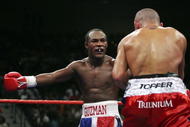 LAS VEGAS - SEPTEMBER 16: (L-R) Joan Guzman of the Dominican Republic taunts Jorge Rodrigo Barrios of Argentina during their WBO World junior lightweight title fight at the MGM Grand Garden Arena September 16, 2006 in Las Vegas, Nevada. Guzman won the title by split decision against Barrios.  (Photo by Ethan Miller/Getty Images)