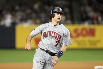 NEW YORK - OCTOBER 07:  Joe Mauer #7 of the Minnesota Twins runs the bases against the New York Yankees in Game One of the ALDS during the 2009 MLB Playoffs at Yankee Stadium on October 7, 2009 in the Bronx borough of New York City.  (Photo by Nick Laham/Getty Images)