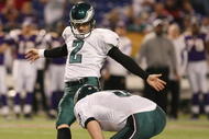 MINNEAPOLIS - JANUARY 04: David Akers #2 of the Philadelphia Eagles kicks a field goal late in the fourth quarter as Sav Rocca #6 holds during the NFC Wild Card playoff game against the Minnesota Vikings on January 4, 2009 at the Hubert H. Humphrey Metrodome in Minneapolis, Minnesota. The Eagles defeated the Vikings 26-14.(Photo by Elsa/Getty Images)