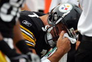 PITTSBURGH, PA - SEPTEMBER 25:  Ben Roethlisberger #7 of the Pittsburgh Steelers rests on the bench after an injury against the New England Patriots during the second quarter at Heinz Field on September 25, 2005 in Pittsburgh, Pennsylvania.  The Patriots won 23-20.  (Photo by Harry How/Getty Images)