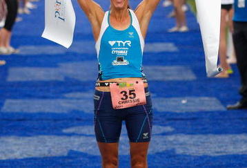 PORT MACQUARIE, AUSTRALIA - APRIL 05:  Chrissie Wellington of the United Kingdom celebrates being the first placed woman in the 2009 Ironman Australia on April 5, 2009 in Port Macquarie, Australia.  (Photo by Cameron Spencer/Getty Images)