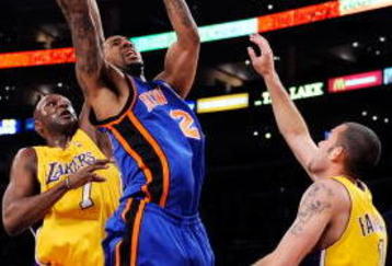 LOS ANGELES, CA - NOVEMBER 24: Wilson Chandler #21 of the New York Knicks elevates to score against Lamar Odom #7 and Jordan Farmar #5 of the Los Angeles Lakers during the fourth quarter of the NBA game at Staples Center on November 24, 2009 in Los Angeles, California. NOTE TO USER: User expressly acknowledges and agrees that, by downloading and/or using this Photograph, user is consenting to the terms and conditions of the Getty Images License Agreement. (Photo by Kevork Djansezian/Getty Images)