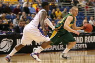 MINNEAPOLIS - MARCH 20:  Ben Woodsie #4 of the North Dakota State Bison drives against Sherron Collins #4 of the Kansas Jayhawks in the first half during the first round of the NCAA Division I Men's Basketball Tournament at the Hubert H. Humphrey Metrodome on March 20, 2009 in Minneapolis, Minnesota.  (Photo by Jonathan Daniel/Getty Images)