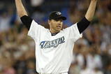 TORONTO - AUGUST 14:  Roy Halladay #32 of the Toronto Blue Jays celebrates his complete game win against the Los Angeles Angels of Anaheim on August 14, 2007 at the Rogers Centre in Toronto, Ontario, Canada.  (Photo by Dave Sandford/Getty Images)