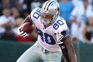 OAKLAND, CA - AUGUST 13: Martellus Bennett #80 of the Dallas Cowboys runs with the ball after catching a pass over Chris Johnson #37 of the Oakland Raiders during a preseason game at Oakland-Alameda County Coliseum on August 13, 2009 in Oakland, California. (Photo by Jed Jacobsohn/Getty Images)