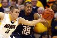 KANSAS CITY, MO - NOVEMBER 24:  Cully Payne #3 of the Iowa Hawkeyes battles Gabe Blair #32 of the Wichita State Shockers for a loose ball during the CBE Classic consolation game on November 24, 2009 at Sprint Center in Kansas City, Missouri.  (Photo by Jamie Squire/Getty Images)