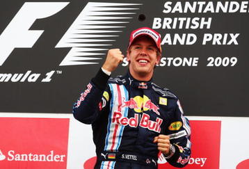 NORTHAMPTON, UNITED KINGDOM - JUNE 21:  Sebastian Vettel of Germany and Red Bull Racing celebrates on the podium after winning the British Formula One Grand Prix at Silverstone on June 21, 2009 in Northampton, England.  (Photo by Clive Mason/Getty Images)