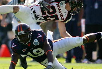 JACKSONVILLE, FL - JANUARY 01:  Danny Amendola #20 of the Texas Tech Red Raiders is tackled by  Ras-I Dowling #19 of the Virginia Cavaliers during the Gator Bowl at Jacksonville Municipal Stadium on January 1, 2008 in Jacksonville, Florida.  (Photo by Sam Greenwood/Getty Images)