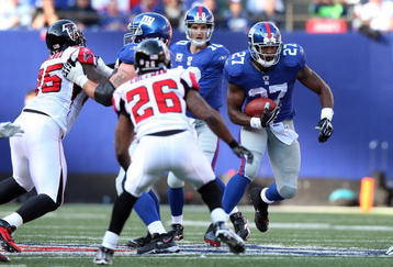 EAST RUTHERFORD, NJ - NOVEMBER 22:  Brandon Jacobs #27 of the New York Giants runs the ball against the Atlanta Falcons on November 22, 2009 at Giants Stadium in East Rutherford, New Jersey.  (Photo by Jim McIsaac/Getty Images)
