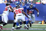 EAST RUTHERFORD, NJ - NOVEMBER 22:  Brandon Jacobs #27 of the New York Giants runs the ball against the Atlanta Falcons on November 22, 2009 at Giants Stadium in East Rutherford, New Jersey.  (Photo by Jim McIsaac/Getty Images)