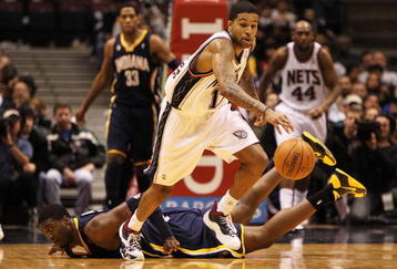 EAST RUTHERFORD, NJ - NOVEMBER 17:  Chris Douglas Roberts #17 of the New Jersey Nets dribbles the ball as Roy Hibbert #55 of The Indiana Pacers lies on the floor during their game on November 17, 2009 at The Izod Center in East Rutherford, New Jersey.  NOTE TO USER: User expressly acknowledges and agrees that, by downloading and/or using this Photograph, user is consenting to the terms and conditions of the Getty Images License Agreement.  (Photo by Al Bello/Getty Images)