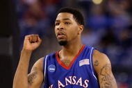 INDIANAPOLIS - MARCH 27: Marcus Morris #22 of the Kansas Jayhawks reacts to a play against the Michigan State Spartans during the third round of the NCAA Division I Men's Basketball Tournament at the Lucas Oil Stadium on March 27, 2009 in Indianapolis, Indiana. (Photo by Andy Lyons/Getty Images)
