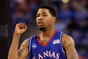 INDIANAPOLIS - MARCH 27:  Marcus Morris #22 of the Kansas Jayhawks reacts to a play against the Michigan State Spartans during the third round of the NCAA Division I Men's Basketball Tournament at the Lucas Oil Stadium on March 27, 2009 in Indianapolis, Indiana.  (Photo by Andy Lyons/Getty Images)