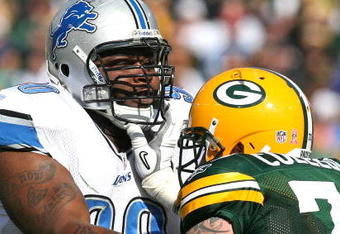 GREEN BAY, WI - OCTOBER 18: Grady Jackson #90 of the Detroit Lions is blocked by Daryn Colledge #73 of the Green Bay Packers at Lambeau Field on October 18, 2009 in Green Bay, Wisconsin. The Packers defeated the Lions 26-0. (Photo by Jonathan Daniel/Getty Images)