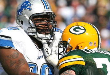 GREEN BAY, WI - OCTOBER 18: Grady Jackson #90 of the Detroit Lions is blocked by Daryn Colledge #73 of the Green Bay Packers at Lambeau Field on October 18, 2009 in Green Bay, Wisconsin. The Packers defeated the Lions 26-0. (Photo by Jonathan Daniel/Getty Images)