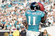 JACKSONVILLE, FL - NOVEMBER 22: Reciever Mike Sims-Walker #11 of the Jacksonville Jaguars catches a touchdown against the Buffalo Bills at Jacksonville Municipal Stadium on November 22, 2009 in Jacksonville, Florida. Jacksonville defeated Buffalo 18-15. (Photo by Marc Serota/Getty Images)