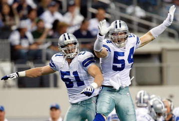 ARLINGTON, TX - NOVEMBER 01: Linebacker Bobby Carpenter #54 of the Dallas Cowboys celebrates a quarterback sack with Keith Brooking #51 at Cowboys Stadium on November 1, 2009 in Arlington, Texas.  (Photo by Ronald Martinez/Getty Images)