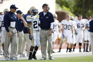 DURHAM, NC - NOVEMBER 14:  Head coach Paul Johnson of the Georgia Tech Yellow Jackets gives instructions to Embry Peeples #24 during the game against the Duke Blue Devils at Wallace Wade Stadium on November 14, 2009 in Durham, North Carolina. (Photo by Joe Robbins/Getty Images)