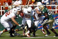 WACO, TX - NOVEMBER 14:  Running back Tre' Newton #23 of the Texas Longhorns carries the ball during the first half against the Baylor Bears on November 14, 2009 at Floyd Casey Stadium in Waco, Texas.   The Longhorns beat the Bears 47-14.  (Photo by Tom Pennington/Getty Images) 