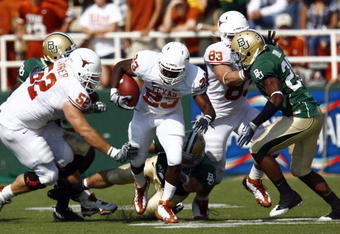 WACO, TX - NOVEMBER 14:  Running back Tre' Newton #23 of the Texas Longhorns carries the ball during the first half against the Baylor Bears on November 14, 2009 at Floyd Casey Stadium in Waco, Texas.   The Longhorns beat the Bears 47-14.  (Photo by Tom Pennington/Getty Images) 