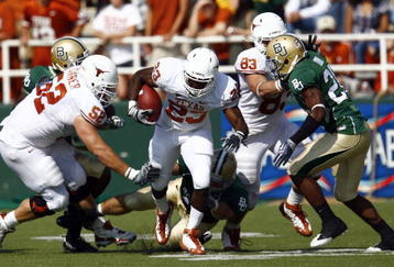 WACO, TX - NOVEMBER 14:  Running back Tre' Newton #23 of the Texas Longhorns carries the ball during the first half against the Baylor Bears on November 14, 2009 at Floyd Casey Stadium in Waco, Texas.   The Longhorns beat the Bears 47-14.  (Photo by Tom Pennington/Getty Images) 