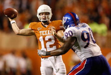 AUSTIN, TX - NOVEMBER 21:  Quarterback Colt McCoy #12 of the Texas Longhorns drops back to pass against Maxwell Onyegbule #90 of the Kansas Jayhawks at Darrell K Royal-Texas Memorial Stadium on November 21, 2009 in Austin, Texas.  (Photo by Ronald Martinez/Getty Images)