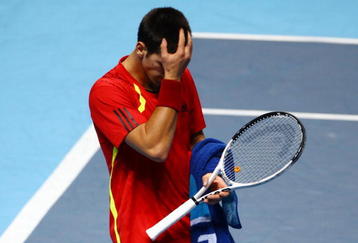 LONDON, ENGLAND - NOVEMBER 25:  Novak Djokovic of Serbia reacts during the men's singles first round match against Robin Soderling of Sweden during the Barclays ATP World Tour Finals at the O2 Arena on November 25, 2009 in London, England.  (Photo by Matthew Lewis/Getty Images for Barclays ATP Finals)
