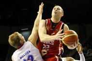 WOLLONGONG, AUSTRALIA - NOVEMBER 25: Tim Coenraad of the Hawks takes on the defence during the round 10 NBL match between the Wollongong Hawks and the Adelaide 36ers  at Wollongong Entertainment Centre on November 25, 2009 in Wollongong, Australia.  (Photo by Mark Nolan/Getty Images)